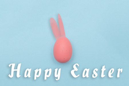 Easter eggs and text on pastel color backgroundの写真素材