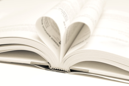 Love learning. Open book with folded pagesの写真素材