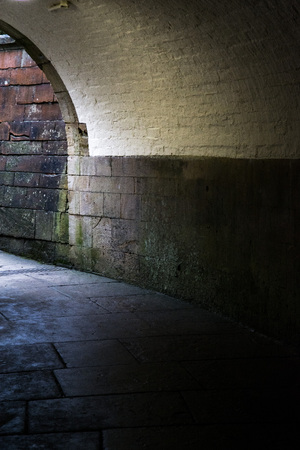 dark tunnel leading to light at the endの写真素材