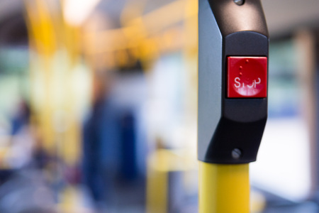 Public transport, inside a bus with stop button and people travelling in the cityの写真素材