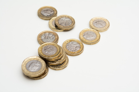 Coins isolated on white background, UK currencyの写真素材