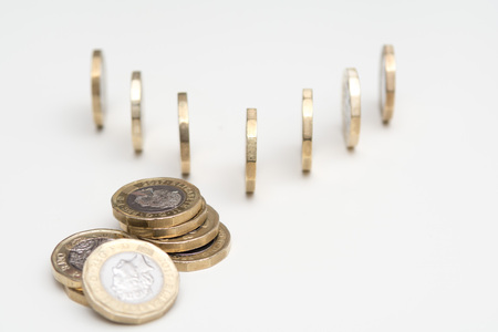 Coins isolated on white background, UK currencyの写真素材