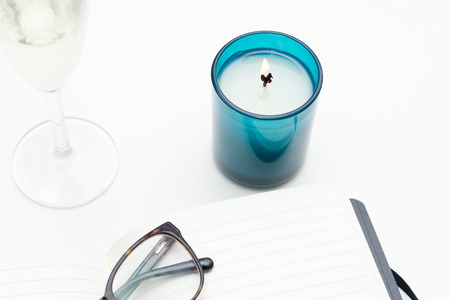 Keeping a diary, and writing a journal overhead of white deskの写真素材