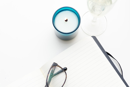 Keeping a diary, and writing a journal overhead of white deskの写真素材