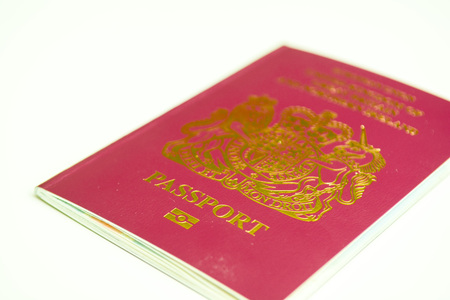 UK Passport isolated on white background, official British passport documentの写真素材