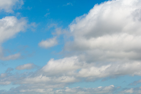 Sky background, clear blue skies with white cloud formationの写真素材