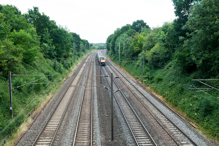 Fast train travelling on the tracks, passenger trainの写真素材