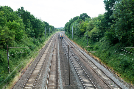 Fast train travelling on the tracks, passenger trainの写真素材