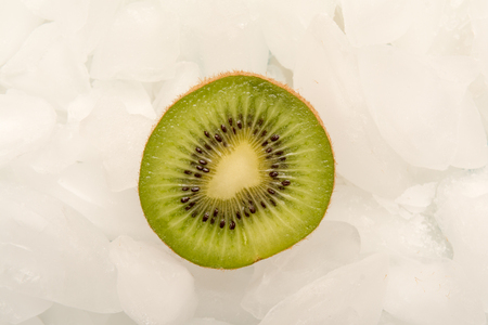 Sliced fresh Kiwi fruit arranged on iceの写真素材