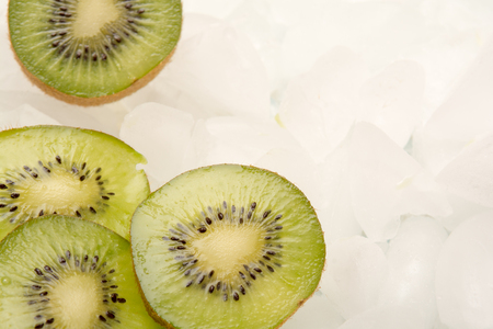 Sliced fresh Kiwi fruit arranged on iceの写真素材