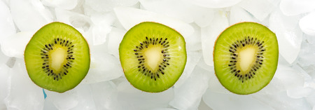Sliced fresh Kiwi fruit arranged on iceの写真素材