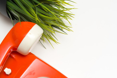 Retro style phone on a white office tableの写真素材