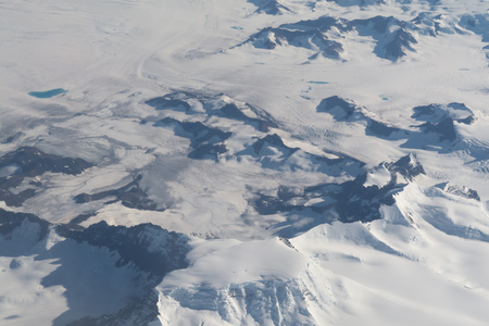 Ariel view of a snow covered mountain rangeの写真素材