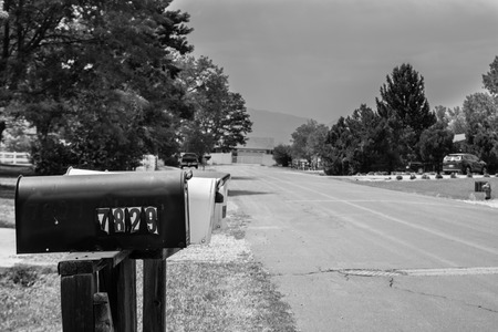 Mail box on the front lawn of an american residenceの写真素材