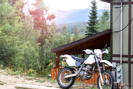 Off road dirt bike parked in the woodsの写真素材