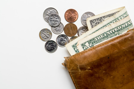 Old leather wallet with notes and moneyの写真素材