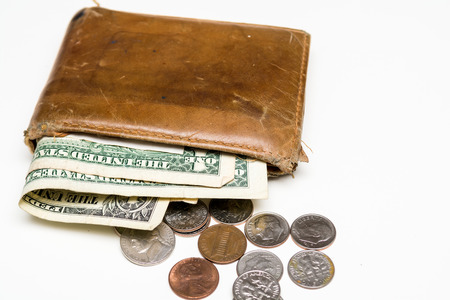 Old leather wallet with notes and moneyの写真素材