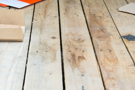 Carpentry background of wooden boards in a workshopの写真素材