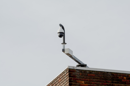 Security camera mounted on a building for cctv recordingの写真素材