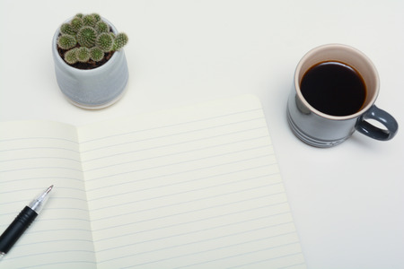 Office desk with note paper left blank to add your own message