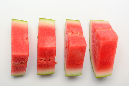Watermelon isolated on white. Sliced fresh melon peices