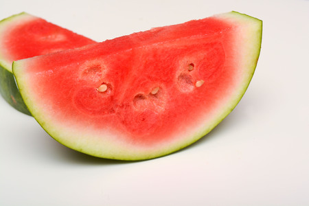 Watermelon isolated on white. Sliced fresh melon peicesの写真素材