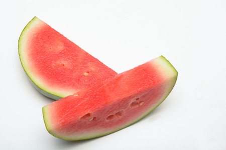 Watermelon isolated on white. Sliced fresh melon peicesの写真素材