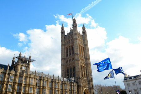 E.U. Flag flying in front of Union ack flag at Houses of Parliament Londonのeditorial素材