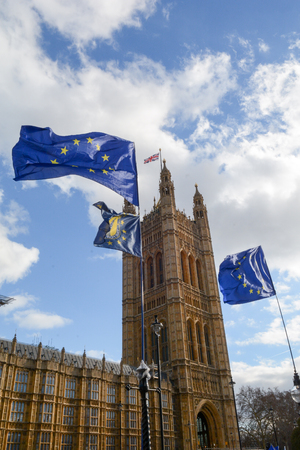 E.U. Flag flying in front of Union ack flag at Houses of Parliament Londonのeditorial素材