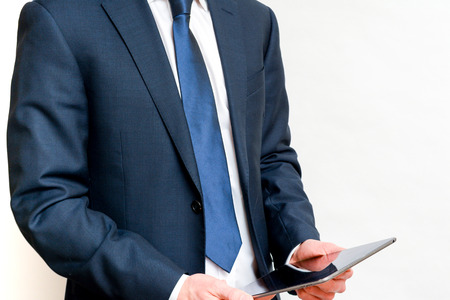 Person using internet enabled portable tablet deviceの写真素材