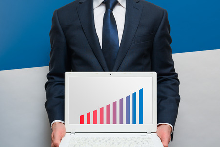 Sales growth and performance chart on a laptop screenの写真素材