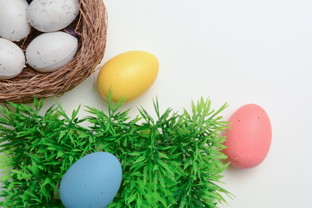 Easter eggs on white background with copy space