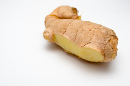 Fresh Ginger root cut and isolated on whiteの写真素材