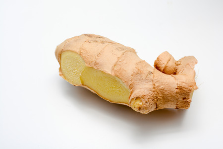 Fresh Ginger root cut and isolated on whiteの写真素材