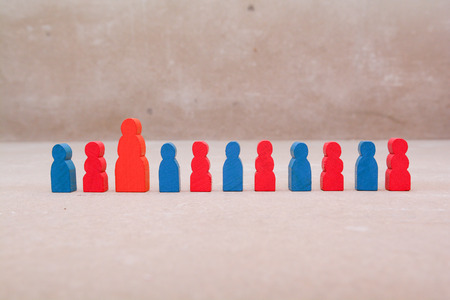 Busy mother. Large group of toy figures of children with mother figureの写真素材