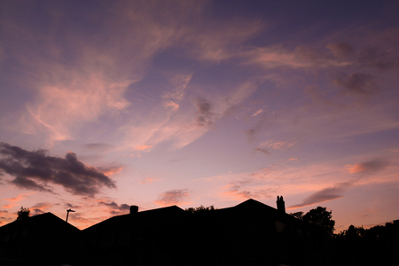 Row of houses in sunset on suburban streetの写真素材