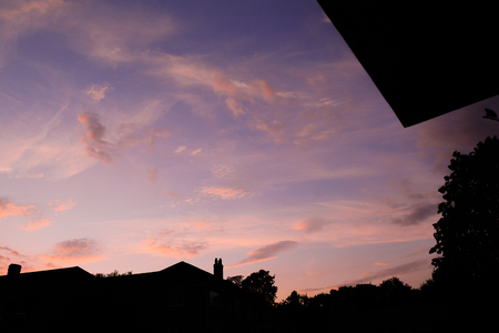 Row of houses in sunset on suburban streetの写真素材