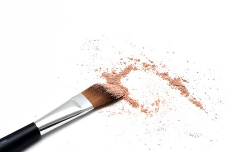 Make up brush with selection of colored make up powder