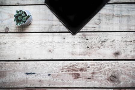 Modern desk work space on wooden table with copy space on wooden tableの写真素材