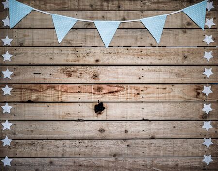 Vintage style background with bunting over wooden boards and copy spaceの写真素材