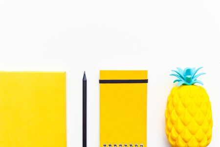 Top view image of office supplies or school accessories, trendy yellow colour objects shot from...