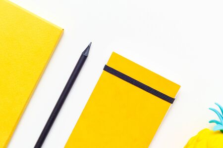 Top view image of office supplies or school accessories, trendy yellow colour objects shot from overheadの写真素材