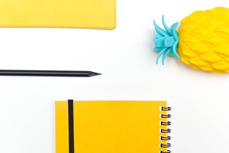 Top view image of office supplies or school accessories, trendy yellow colour objects shot from...