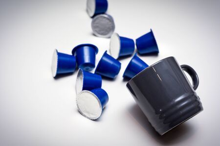 Coffee pods for instant coffee at home on a white table with espresso cupの写真素材