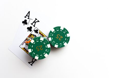 Black Jack cards with pile of casino chips as winning betの写真素材