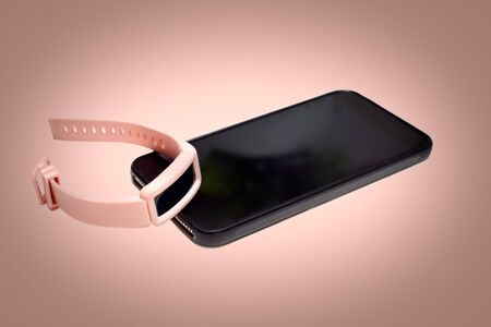 Pink sports activity tracker and step counter can be synced with smart phone app to record healthy...