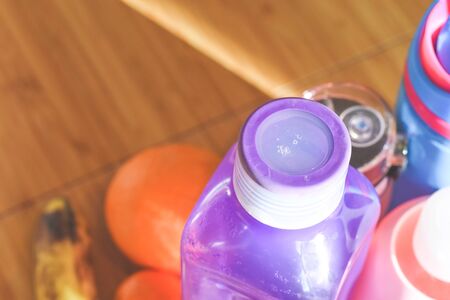Group of water bottles and healthy fruit snack for the family on a kitchen table in the morningの写真素材