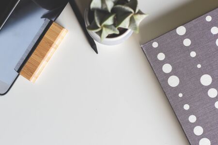 Office objects on a white desk in light modern style with copy spaceの写真素材