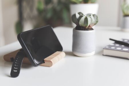 Office objects on a white desk in light modern style with copy space