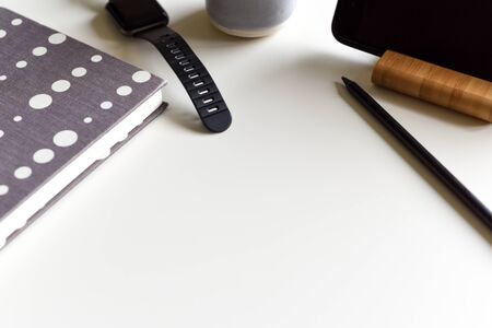 Office objects on a white desk in light modern style with copy spaceの写真素材